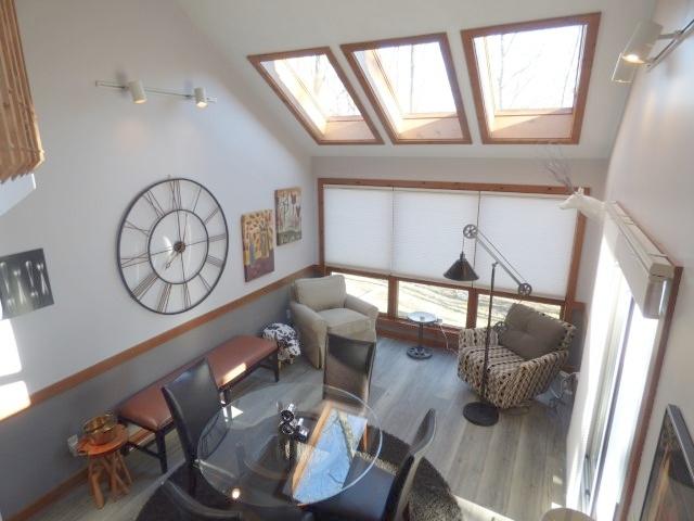 2 Tamarack Row, Galena, IL 61036 - sitting room featuring a skylight, wood finished floors, healthy amount of natural light, and vaulted ceiling