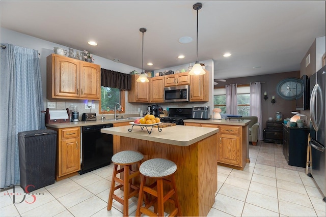 2598 N 2739th Rd, Marseilles, IL 61341 - kitchen featuring black appliances, a kitchen island, light tile patterned floors, a sink, and recessed lighting