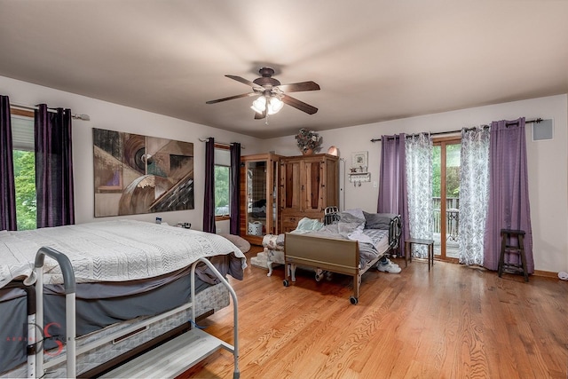 2598 N 2739th Rd, Marseilles, IL 61341 - bedroom featuring access to exterior, light wood-style flooring, and a ceiling fan