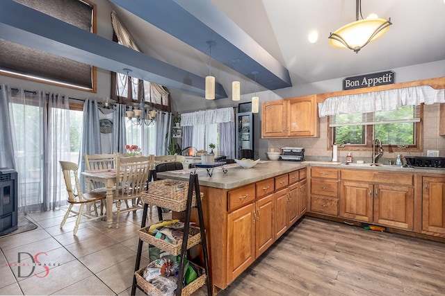 2598 N 2739th Rd, Marseilles, IL 61341 - kitchen with a sink, pendant lighting, backsplash, light countertops, and high vaulted ceiling