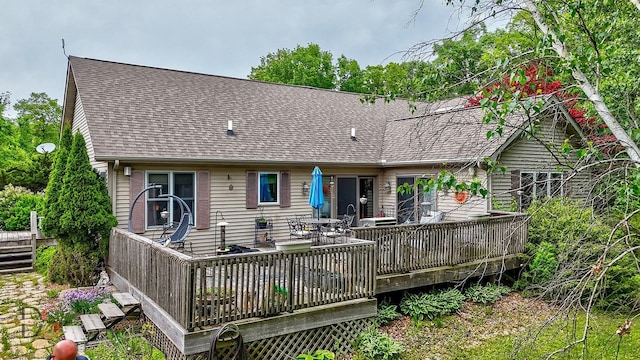 2598 N 2739th Rd, Marseilles, IL 61341 - rear view of house featuring a shingled roof, a deck, and outdoor dining space