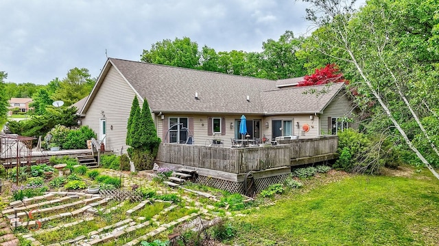 2598 N 2739th Rd, Marseilles, IL 61341 - rear view of property with a wooden deck, a shingled roof, and a lawn