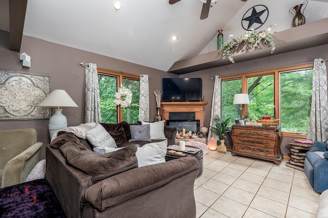 2598 N 2739th Rd, Marseilles, IL 61341 - living area with light tile patterned flooring, a glass covered fireplace, a ceiling fan, high vaulted ceiling, and recessed lighting