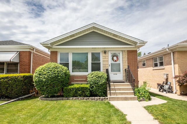 6136 N Nagle Ave, Chicago, IL 60646 - view of front of home featuring a front lawn and brick siding