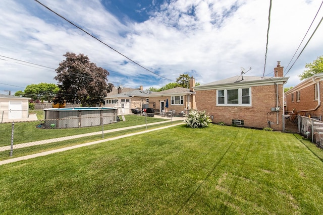 6136 N Nagle Ave, Chicago, IL 60646 - rear view of property with brick siding, a chimney, and an outdoor pool