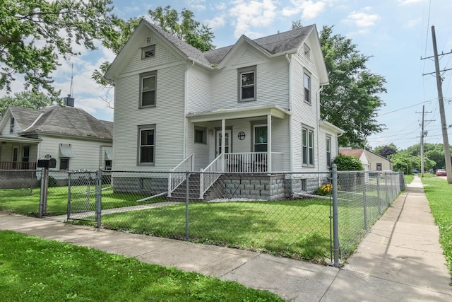 904 E Madison St, Pontiac, IL 61764 - view of front of house with a porch, a gate, and a fenced front yard