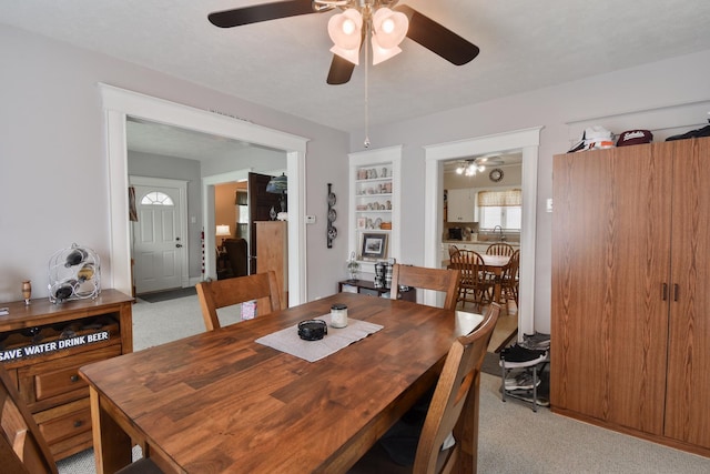 904 E Madison St, Pontiac, IL 61764 - dining space with a ceiling fan and light colored carpet