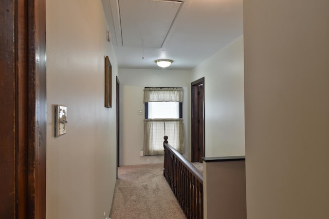 904 E Madison St, Pontiac, IL 61764 - hallway featuring attic access, light carpet, and an upstairs landing