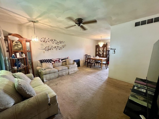 1405 W Beech St, Urbana, IL 61801 - living room featuring a ceiling fan, carpet floors, and a chandelier