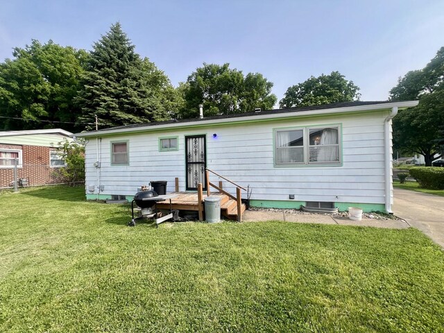 1405 W Beech St, Urbana, IL 61801 - rear view of property featuring a lawn
