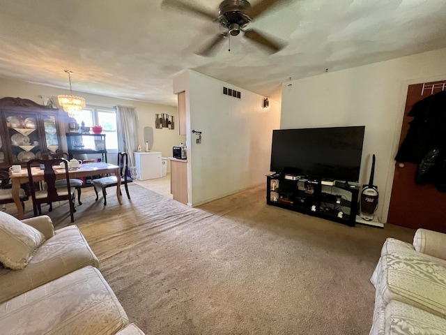 1405 W Beech St, Urbana, IL 61801 - living area with ceiling fan, a chandelier, and carpet