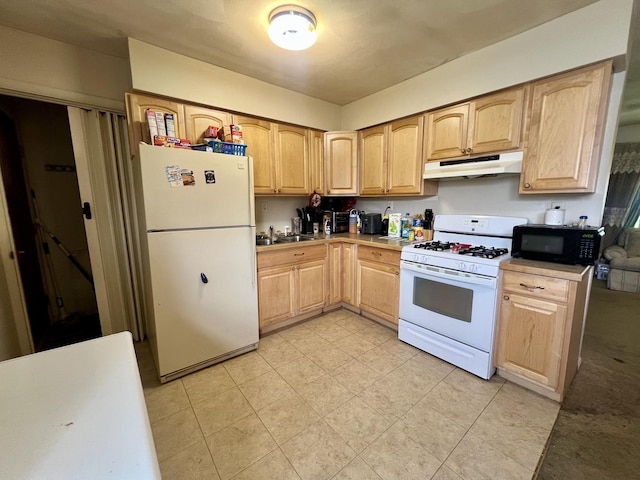1405 W Beech St, Urbana, IL 61801 - kitchen with white appliances, under cabinet range hood, light brown cabinets, a sink, and light countertops