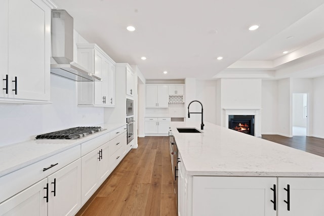 3245 Lincoln Prairie Blvd, Aurora, IL 60503 - kitchen with a sink, wall chimney range hood, stainless steel appliances, recessed lighting, and light wood-style flooring