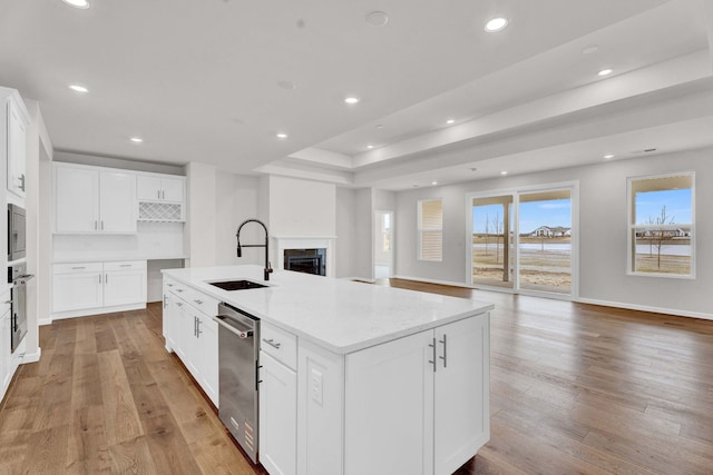 3245 Lincoln Prairie Blvd, Aurora, IL 60503 - kitchen with a sink, open floor plan, stainless steel appliances, light wood-style floors, and recessed lighting