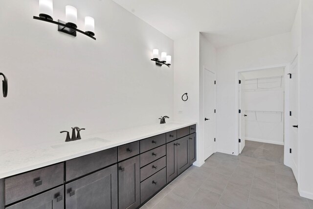 3245 Lincoln Prairie Blvd, Aurora, IL 60503 - bathroom featuring vanity, a walk in closet, a tile shower, and tile patterned flooring
