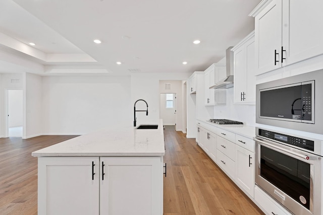 3245 Lincoln Prairie Blvd, Aurora, IL 60503 - kitchen with appliances with stainless steel finishes, a sink, light wood-type flooring, a kitchen island with sink, and recessed lighting