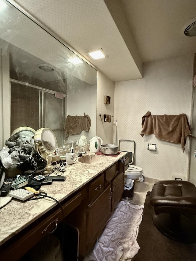 1545 Winnetka Rd Unit 1545, Glenview, IL 60025 - full bath featuring a stall shower, toilet, vanity, a bidet, and tile patterned floors