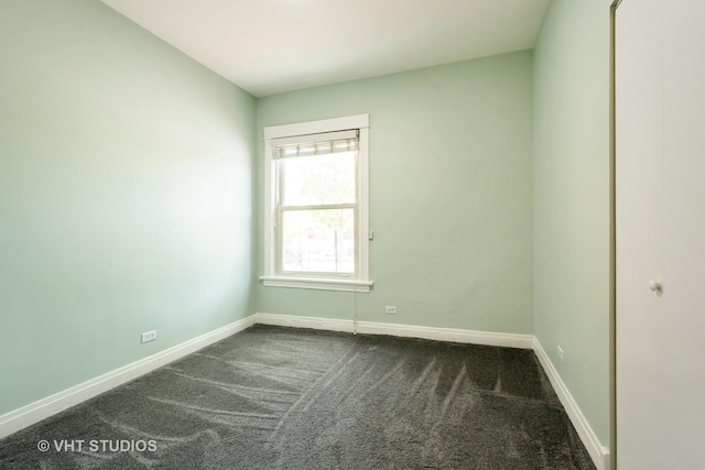 4148 N Clarendon Ave Unit 102, Chicago, IL 60613 - empty room with dark carpet and baseboards