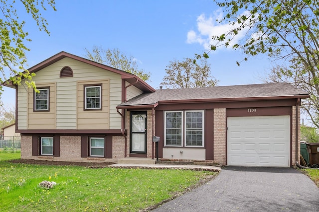 3858 Holly Ct, Country Club Hills, IL 60478 - split level home with brick siding, a garage, driveway, and a front yard