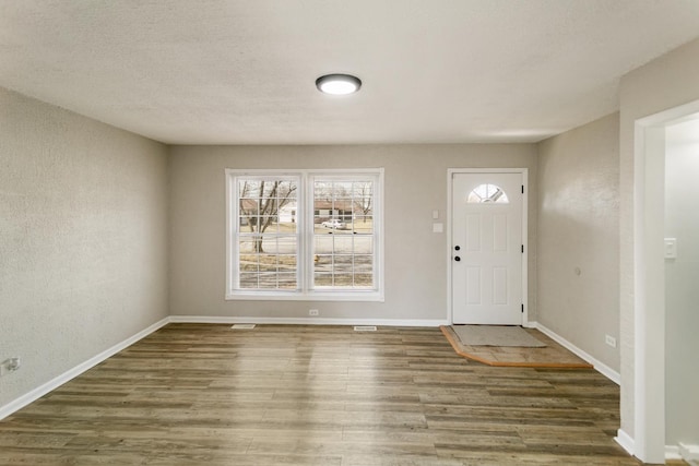 3858 Holly Ct, Country Club Hills, IL 60478 - foyer with wood finished floors, baseboards, and a textured wall
