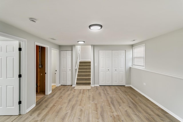 3858 Holly Ct, Country Club Hills, IL 60478 - unfurnished bedroom featuring two closets, light wood-style flooring, and baseboards