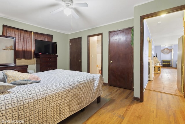 611 Palace St, Aurora, IL 60506 - bedroom with ornamental molding, light wood-style floors, baseboards, ceiling fan, and connected bathroom