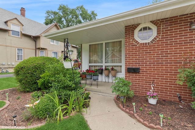 611 Palace St, Aurora, IL 60506 - view of exterior entry with brick siding and covered porch