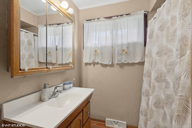 611 Palace St, Aurora, IL 60506 - bathroom featuring vanity, crown molding, a shower with shower curtain, and tile patterned floors