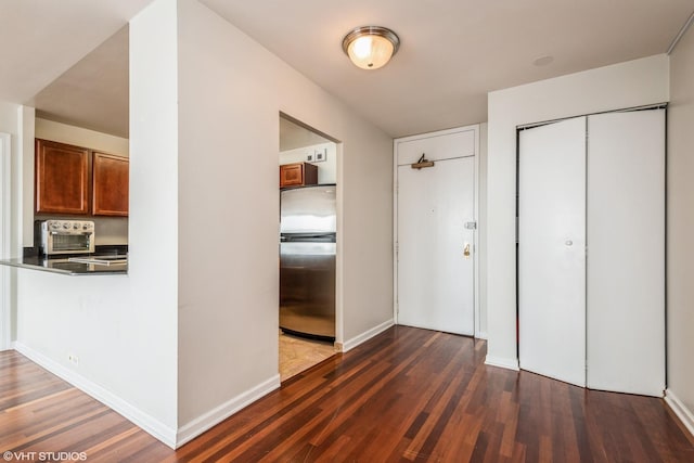 525 W Hawthorne Pl Unit 2701, Chicago, IL 60657 - hall featuring dark wood-style flooring and baseboards