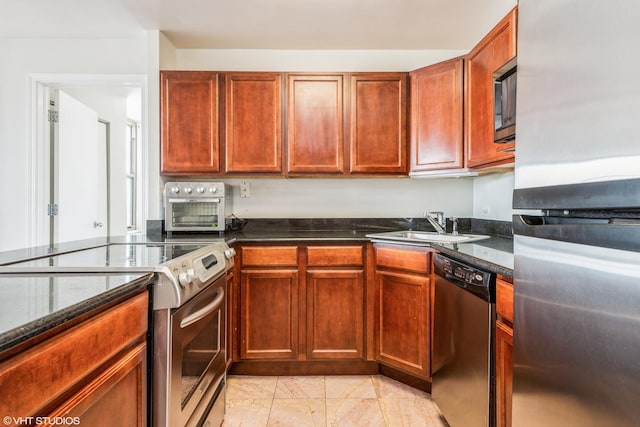 525 W Hawthorne Pl Unit 2701, Chicago, IL 60657 - kitchen featuring appliances with stainless steel finishes, a sink, dark stone counters, and light marble finish flooring