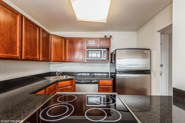 525 W Hawthorne Pl Unit 2701, Chicago, IL 60657 - kitchen with appliances with stainless steel finishes, a sink, and dark stone countertops
