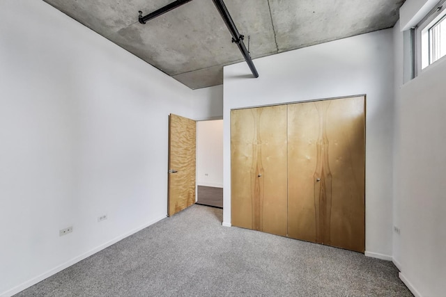 700 W Van Buren St Unit 1301, Chicago, IL 60607 - unfurnished bedroom featuring carpet flooring, baseboards, and a closet