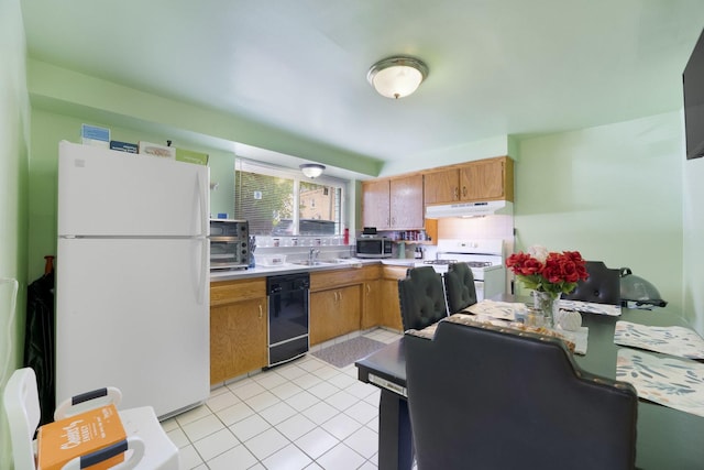 6850 Cermak Rd Unit Gb, Berwyn, IL 60402 - kitchen with white appliances, under cabinet range hood, a sink, light tile patterned floors, and light countertops