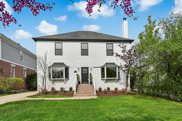 4468 Clausen Ave, Western Springs, IL 60558 - view of front of house featuring a front yard, a chimney, and brick siding