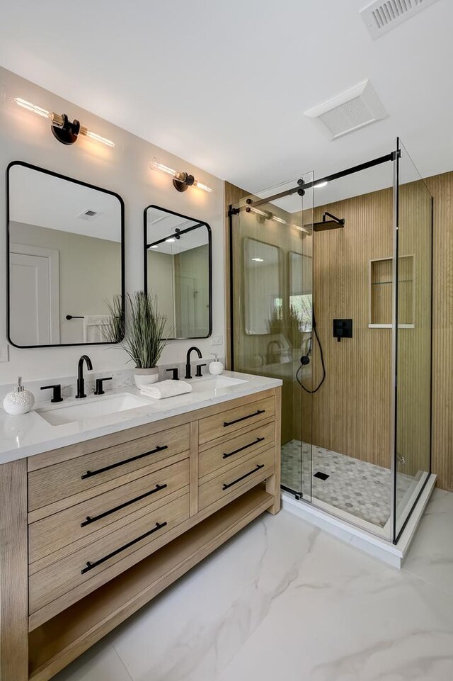 4468 Clausen Ave, Western Springs, IL 60558 - bathroom featuring double vanity, marble look tiles, and a shower stall