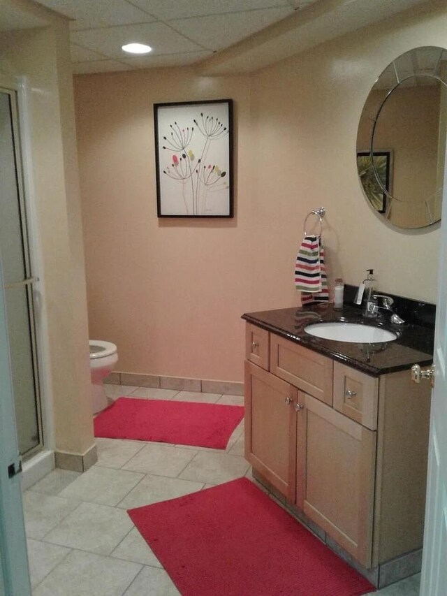 121 Chatsworth Cir, Schaumburg, IL 60194 - bathroom with vanity, toilet, a shower stall, tile patterned flooring, and baseboards