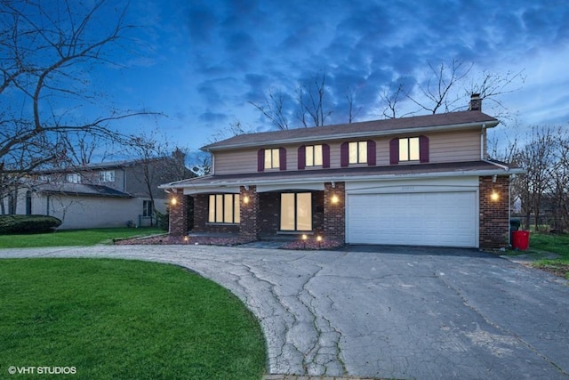 20832 Sparta Ln, Olympia Fields, IL 60461 - traditional-style home with driveway, a chimney, a garage, a front yard, and brick siding
