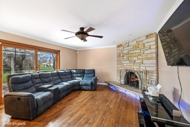20832 Sparta Ln, Olympia Fields, IL 60461 - living area featuring a stone fireplace, a ceiling fan, wood-type flooring, and ornamental molding