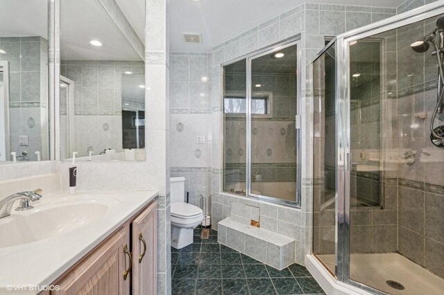 20832 Sparta Ln, Olympia Fields, IL 60461 - bathroom with tile patterned flooring, toilet, vanity, a shower stall, and tile walls