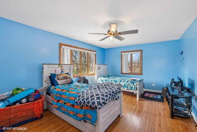 20832 Sparta Ln, Olympia Fields, IL 60461 - bedroom with baseboards, wood finished floors, and ceiling fan