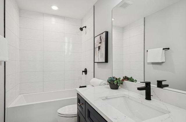 4102 W Eddy St, Chicago, IL 60641 - bathroom featuring toilet, vanity, shower / bathtub combination, and recessed lighting