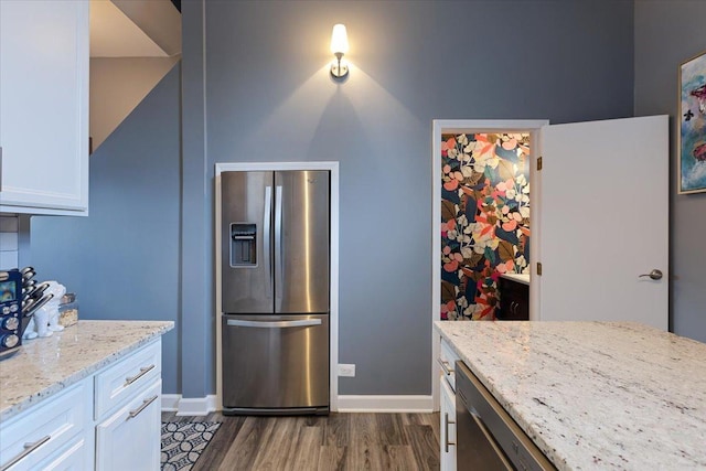 3713 Grand Blvd Unit 10, Brookfield, IL 60513 - kitchen featuring appliances with stainless steel finishes, dark wood-type flooring, white cabinetry, and light stone countertops