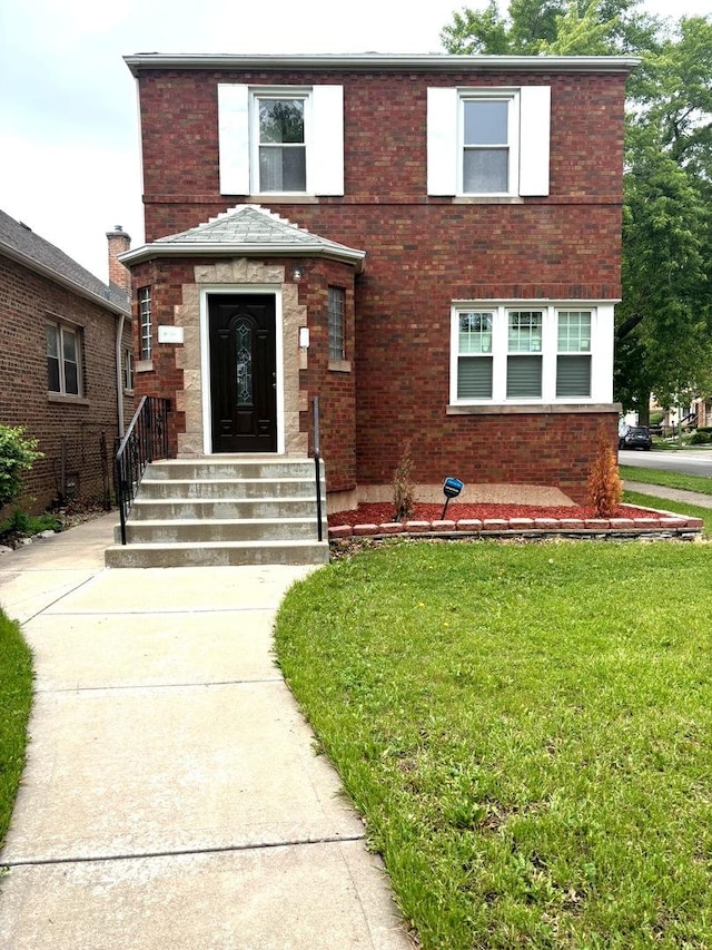 1900 W 83rd St Unit 0, Chicago, IL 60620 - traditional-style house with a front lawn and brick siding