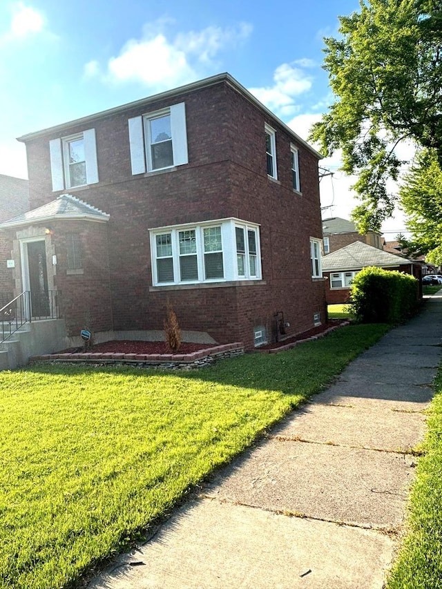 1900 W 83rd St Unit 0, Chicago, IL 60620 - view of side of home featuring brick siding and a lawn