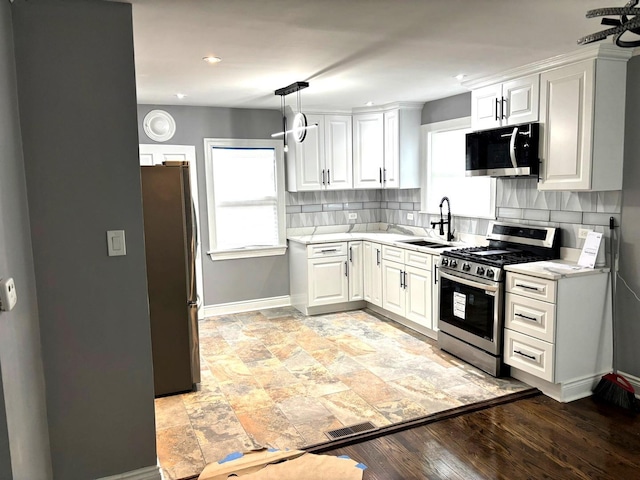 1900 W 83rd St Unit 0, Chicago, IL 60620 - kitchen with appliances with stainless steel finishes, healthy amount of natural light, decorative backsplash, white cabinets, and recessed lighting