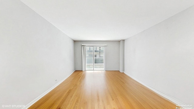1567 Ridge Ave Unit 307, Evanston, IL 60201 - spare room with baseboards and light wood-style flooring