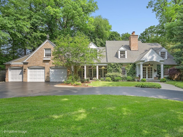 1360 Turvey Rd, Downers Grove, IL 60515 - view of front of property featuring french doors, driveway, a front lawn, and a chimney
