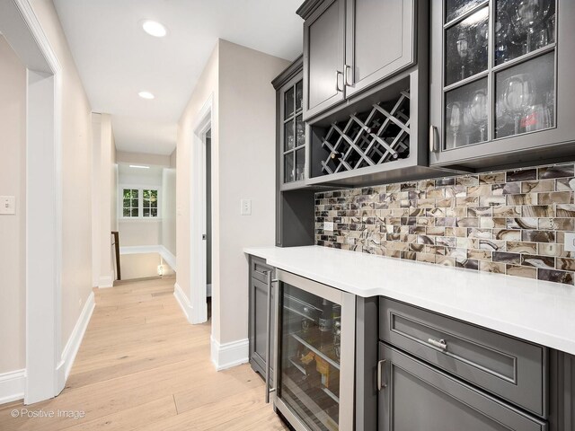 1360 Turvey Rd, Downers Grove, IL 60515 - indoor dry bar featuring beverage cooler, light wood-type flooring, tasteful backsplash, and recessed lighting