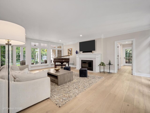1360 Turvey Rd, Downers Grove, IL 60515 - living room featuring a fireplace with flush hearth, recessed lighting, ornamental molding, and light wood-style flooring