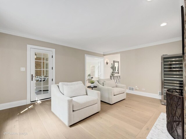 1360 Turvey Rd, Downers Grove, IL 60515 - living room featuring light wood-type flooring, crown molding, wine cooler, and recessed lighting